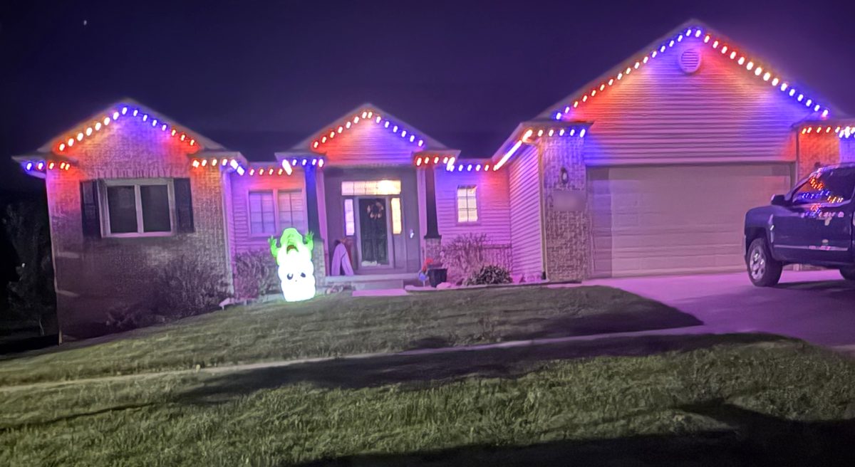 The Wiltse home lit with permanent Trimlight lighting in Halloween orange and purple